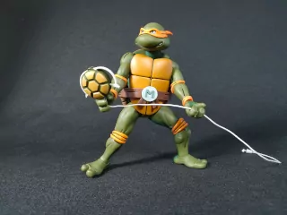 Imagen de la figura de Michelangelo Cartoon con su gancho