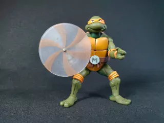Imagen de la figura de Michelangelo Cartoon con su nunchaku giratorio