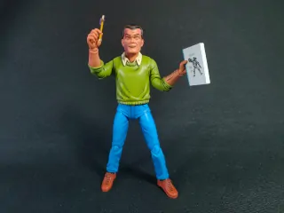 Imagen de la figura de Kirby con su cuaderno y lápiz