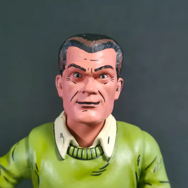 Imagen del rostro de la figura de Jack Kirby con los reflejos del cabello