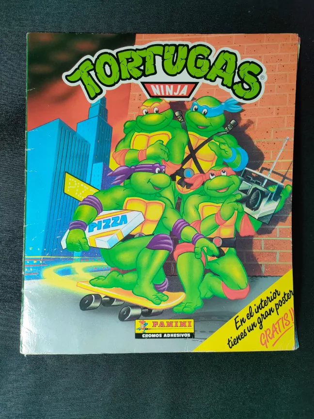 Imagen de la portada del álbum de cromos de Las Tortugas Ninja de Panini de 1990